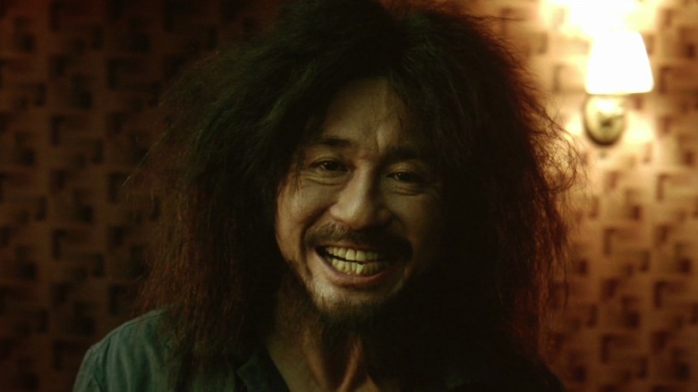 Oh Dae-su smiles in "Oldboy" (2003)