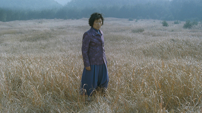 Mother standing in field