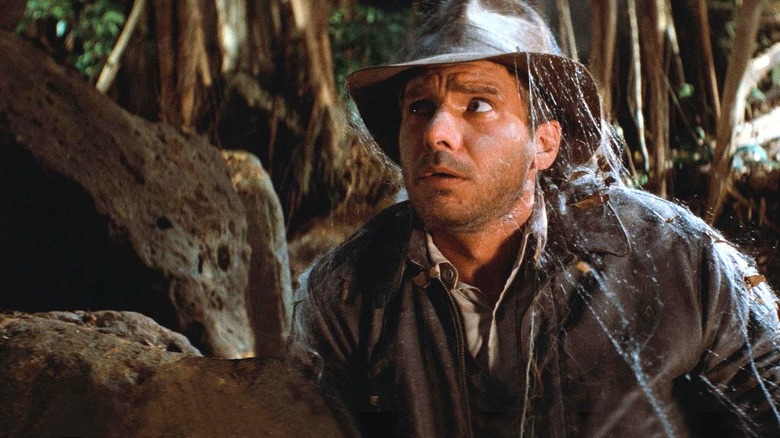 Indiana Jones covered in cobwebs in "Raiders of the Lost Ark."