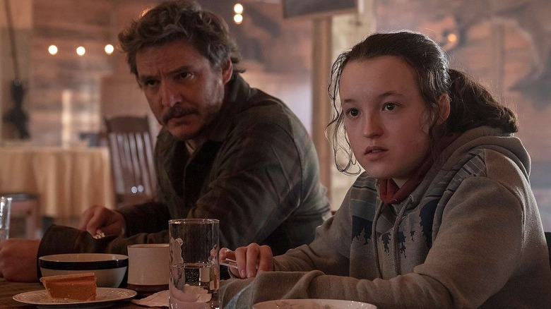 Joel and Ellie sitting at a table in The Last of Us" (2023-present)
