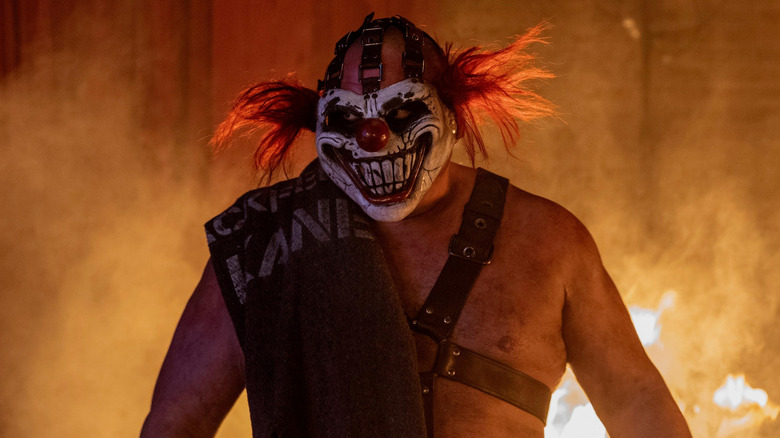 Sweet Tooth with flames behind him in "Twisted Metal" (2023-present)