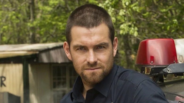 A cop in the woods in Banshee