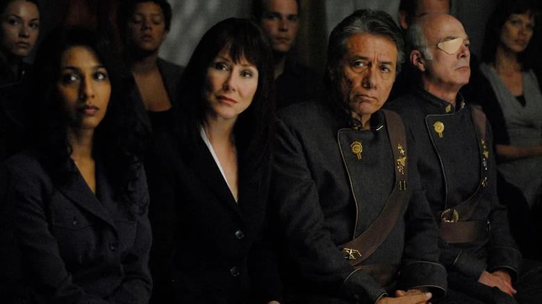 Roslin and Adama sit in an assembly of powerful leaders in "Battlestar Galactica" (2003-2009)