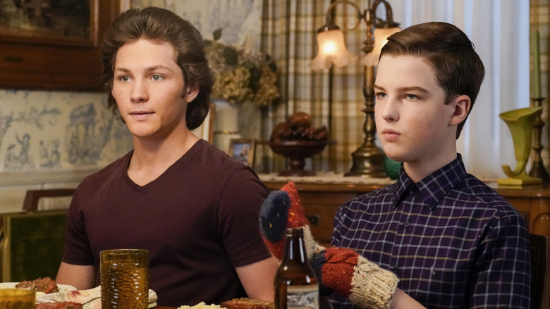Georgie and Sheldon at dinner in "Young Sheldon"