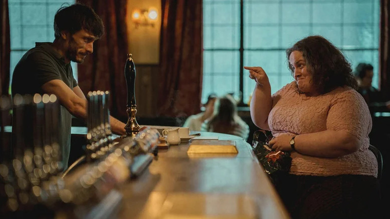 Donny and Martha talking across the bar in Baby Reindeer