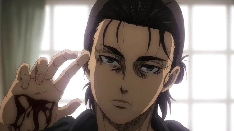 Eren holding up his hand, showing a cut in the palm, in "Attack on Titan."