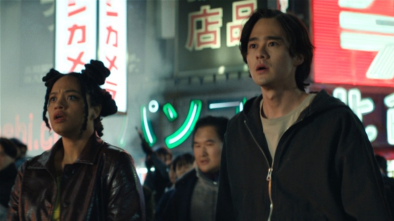 May and Kentaro looking scared in the city on 