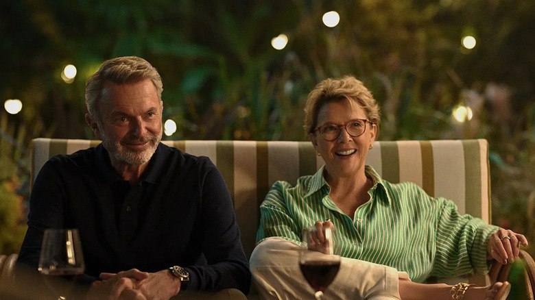 Stan and Joy sitting on a couch outside in "Apples Never Fall."
