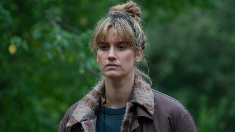 Naia standing in the woods in The Chestnut Man (2021)