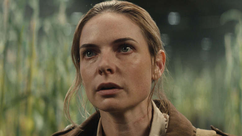 Nichols walks through a cornfield in Silo (2023-)