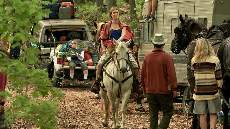 Matilda rides a horse through a small encampment in Station Eleven (2021-2022)