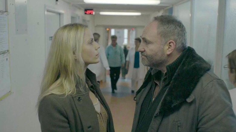 Saga and Martin confront each other in a hospital corridor in the Bridge.