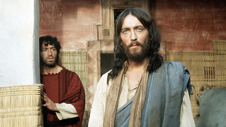 Jesus Christ looks onward with an acolyte behind him in Jesus of Nazareth (1977)