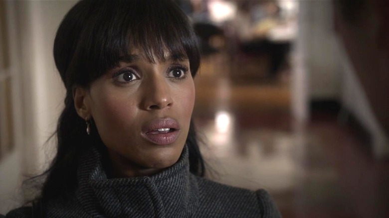 Olivia looks upset while speaking to someone off camera.
