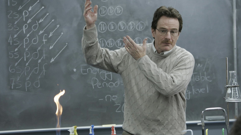 Walter White gesturing in front of classroom blackboard