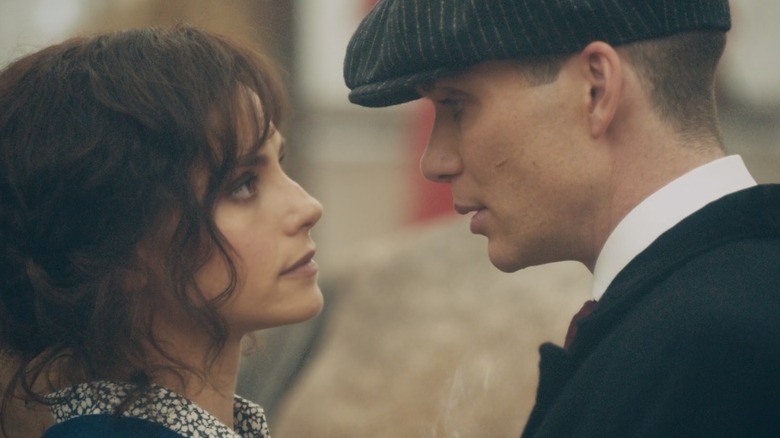Ada and Thomas Shelby preparing to kiss