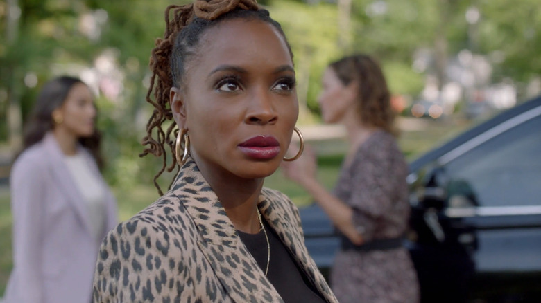 Gabrielle stands in the street in Found.