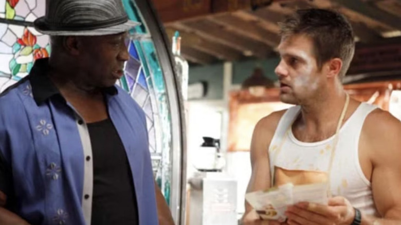 Sherman and Leo talk in an office in The Finder.