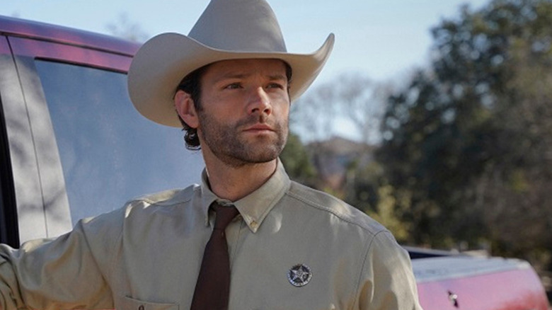 Walker stands outside his truck in Walker.