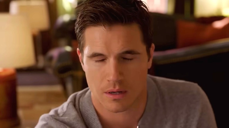 Nathan with closed eyes in Upload