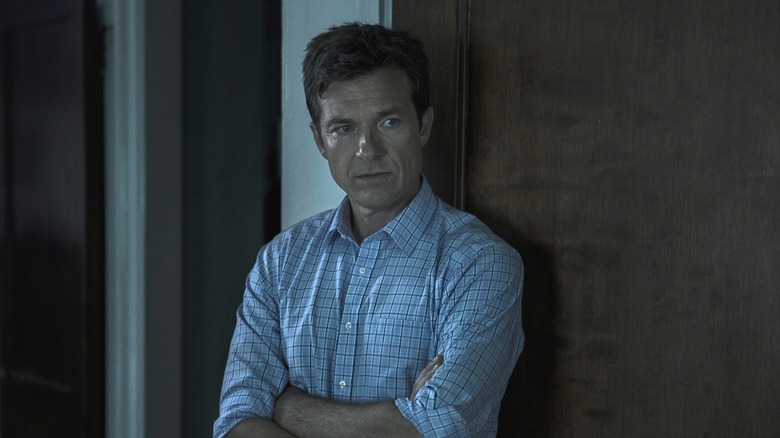Marty leaning against a wall in "Ozark" (2017-2022)
