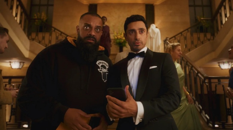 Zulfi and Shah at the bottom of an ornate staircase in "Bait"