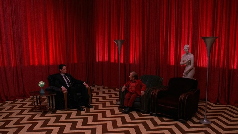 Dale Cooper and The Man From Another Place sit in the Red Room in "Twin Peaks"