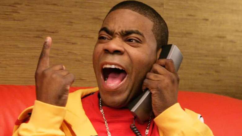 Tracy Jordan gesturing and speaking angrily on a landline phone in his swanky dressing room