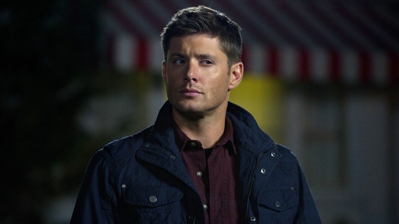 Dean, wearing a blue jacket, giving side eye in Supernatural