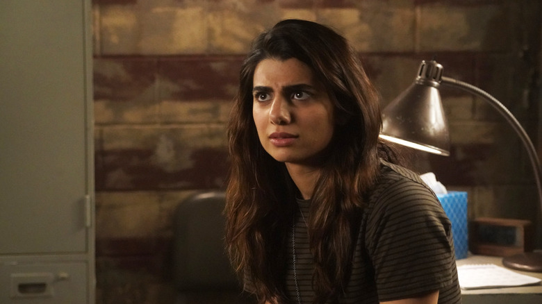 Jiya in office looking concerned in Timeless