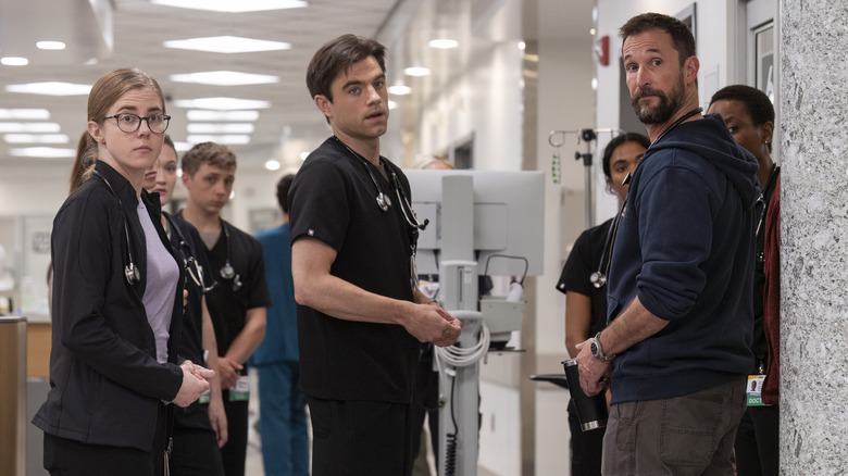 The Pitt team standing in ER hallway