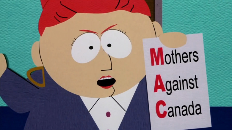 Sheila Broflovski holding up a Mothers Against Canada sign in South Park: Bigger, Longer and Uncut