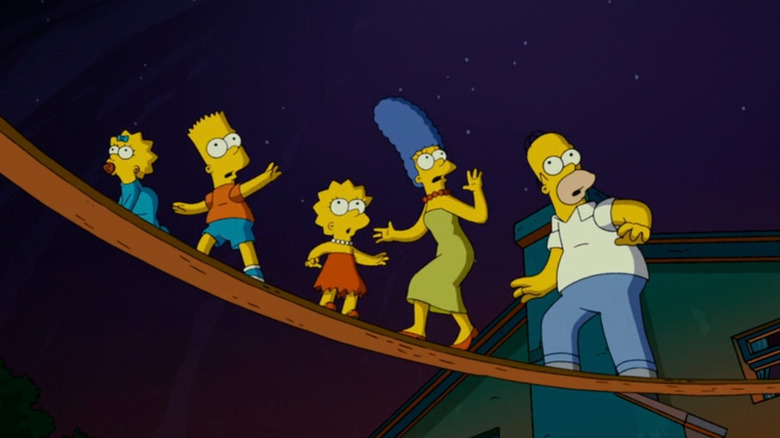 The Simpsons family walking on a plank of wood in The Simpsons Movie