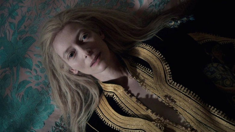Eve reclining on a rug, her hair splayed out around her, in Only Lovers Left Alive