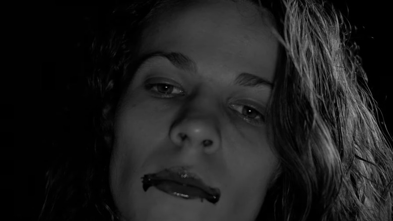 Kathleen with blood smeared on her mouth in The Addiction