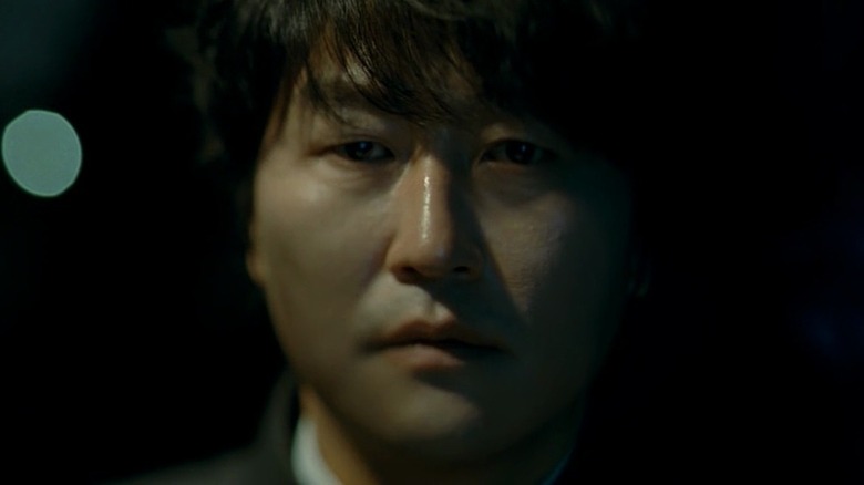 Sang-hyun staring at camera in "Thirst"