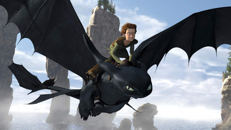 Hiccup riding Toothless through the skies in How to Train Your Dragon (2010)