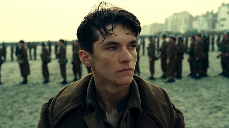 Tommy on the beach looking to the side in 