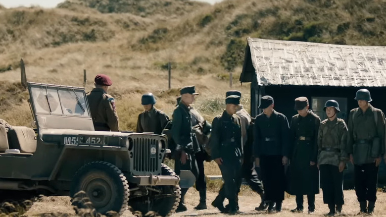 German POWs standing at attention in "Land of Mine"