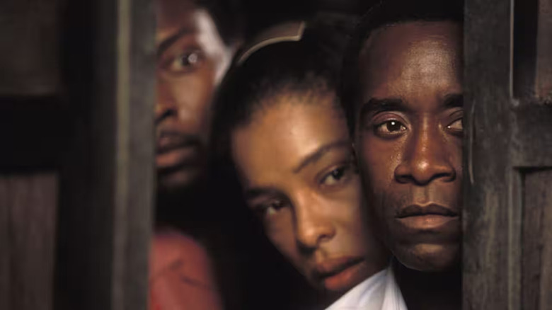 Paul with refugees hiding behind him in Hotel Rwanda