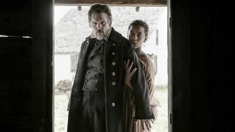 John Brown and Onion standing in a doorway on The Good Lord Bird (2020)