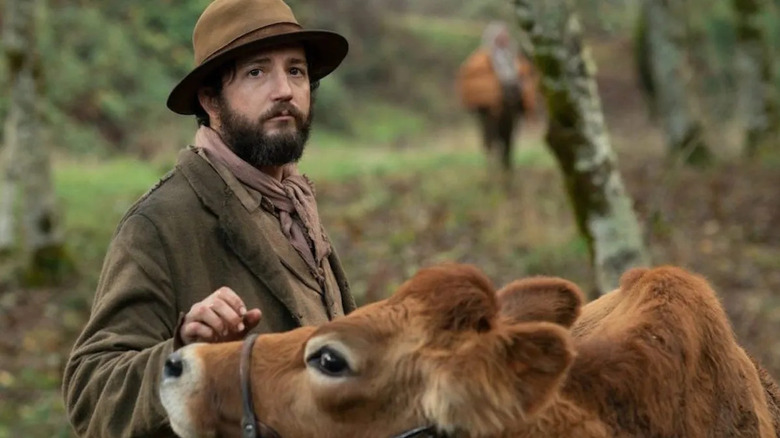 Otis with the cow in First Cow (2019)