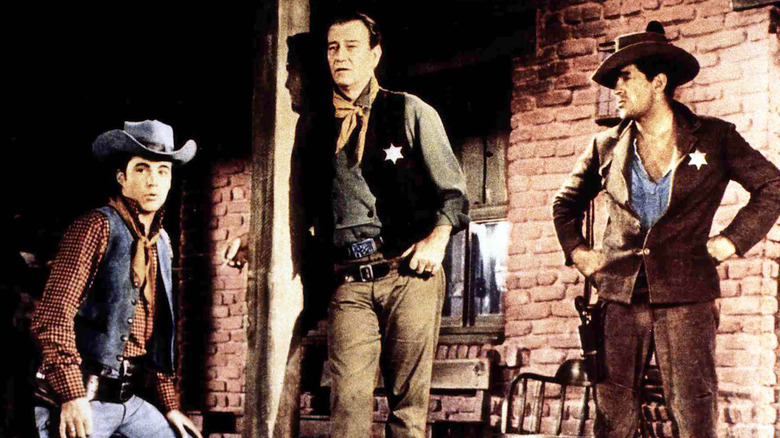 Colorado Ryan, John T. Chance, and Dude stand about in Rio Bravo