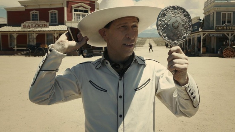 Buster Scruggs aims gun