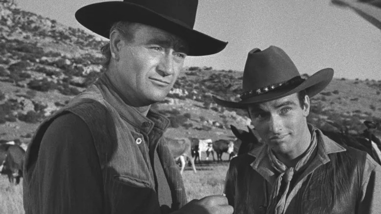 Thomas Dunson stands beside Matt Garth in Red River (1948)