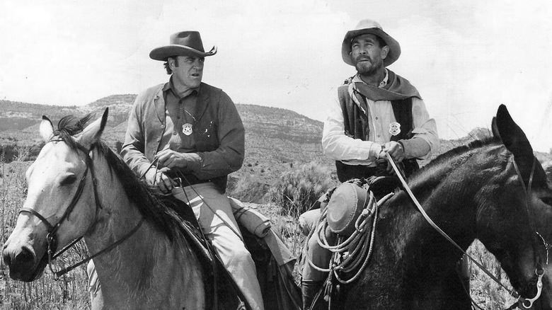 U.S. Marshal Matt Dillon and Festus Haggen sitting on horses on Gunsmoke (1955-1975)