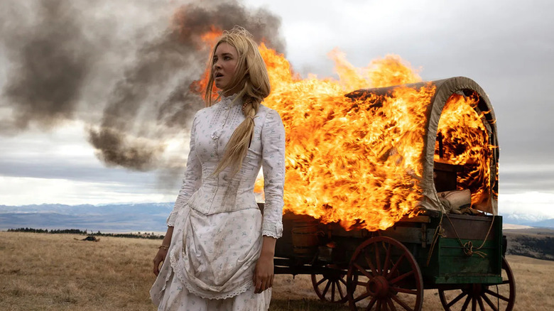 Elsa in front of a burning covered wagon in 1883