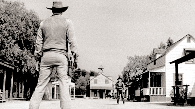 Matt Dillon facing down against an outlaw in Gunsmoke