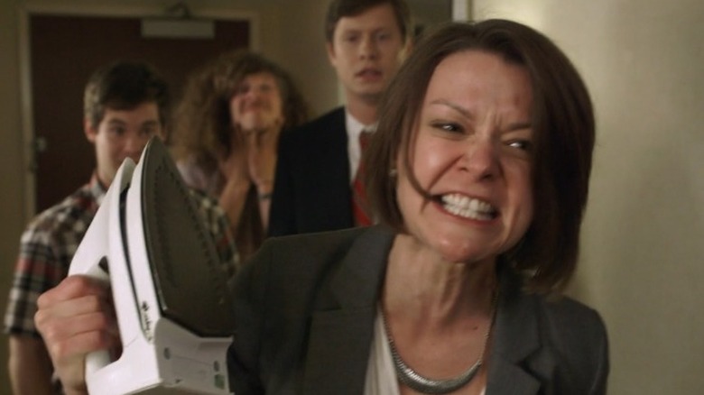 Alice brandishes an iron