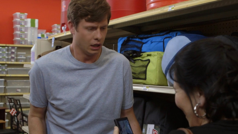 Horrified Anders looks at Alex Borstein's phone